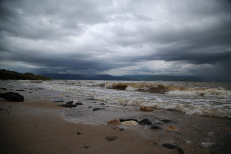 The waves of the Sea of Galilee crash on the beach of, Israelの写真素材