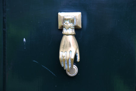An antique brass door knocker