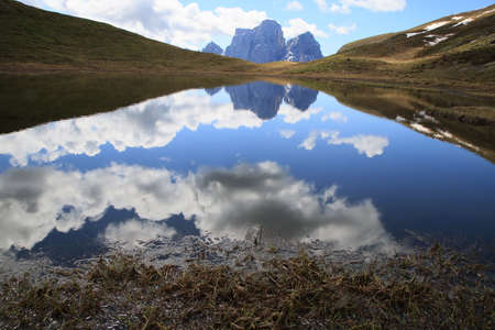 The Baste lake with Mount Pelmo in the backgroundの写真素材