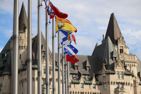 Flags blowing in the wind in front of the Fairmont Chateau laurier, Ottawa