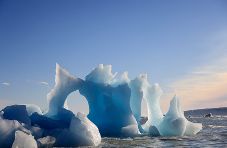Iceberg drifting in the sea in front of the Austofonna Ice Cap