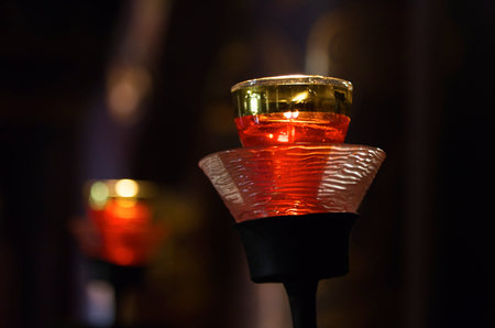 Votive lights in the interior of a Buddhist temple in Hanoi, Vietnam