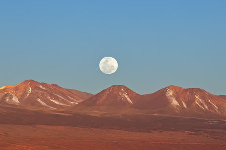 Spectacular moon over the Atacama Desert at sunset, Chileの写真素材