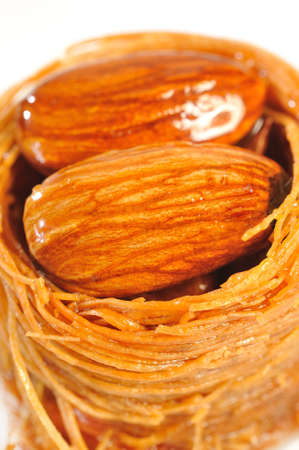 almonds with glaze a white background の写真素材