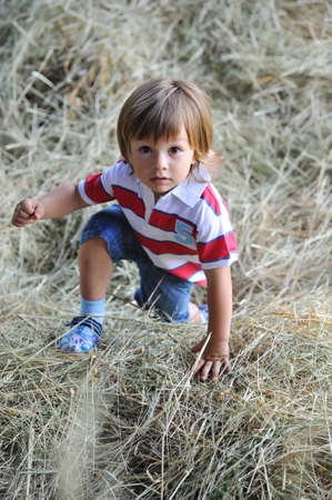 child in the hayの写真素材