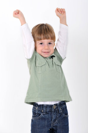 boy with hands raisedの写真素材