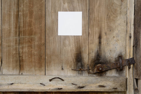 Old door with a noteの写真素材