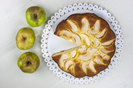 Homemade italian baked apple pie over a white tableの写真素材