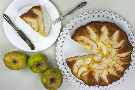 Homemade italian baked apple pie over a white tableの写真素材