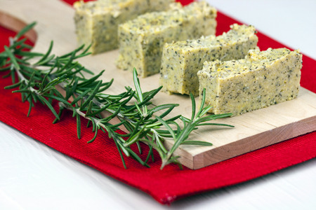 Baked polenta "taragna" (corn and buckwheat flours) with italian cheese (taleggio, gorgonzola, parmigiano reggiano) and rosemaryの写真素材