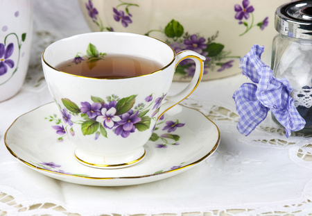 English afternoon tea with sweet and candied violetsの写真素材