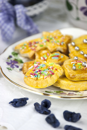 English afternoon tea with cookies and candied violetsの写真素材