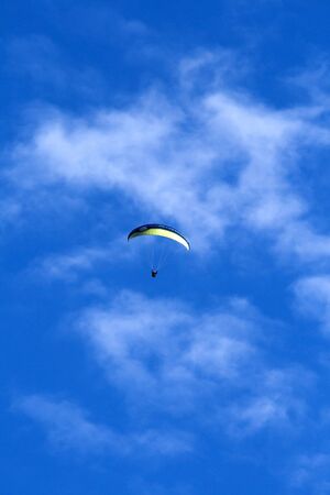 Paragliding in the blue skyの写真素材
