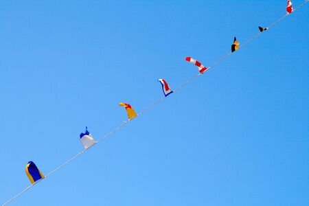 Nautical flags against blue skyの写真素材
