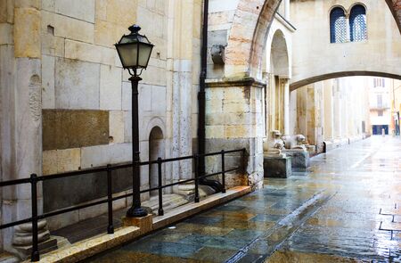 Side street at cathedral of Modena with streelamp.の写真素材