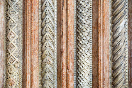 Stone sculptures on the exterior of the Cathedral in Modena (Italy)の写真素材