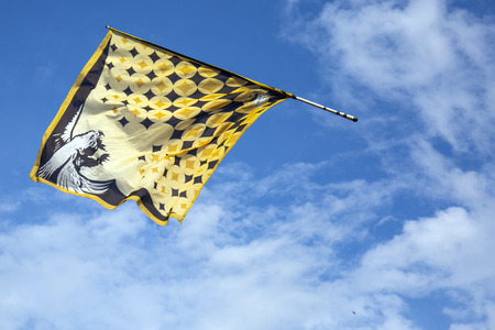 Traditional italian festival with flag throwers.Flags on the blue sky.の写真素材