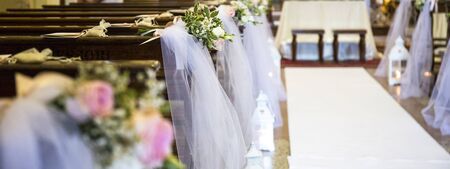 Beautiful flowers wedding decoration in a church.の写真素材