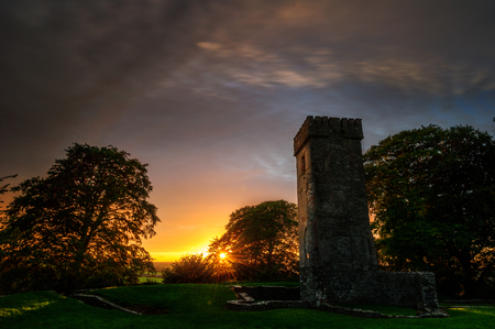 The Survivor: as every evenings passing on, the remaining of that Ancient Castle is still up to watch what beauty would bring the next Sunset played by Master Sun! Cu Chulainn, Dundalk, Louth, Irelandの写真素材