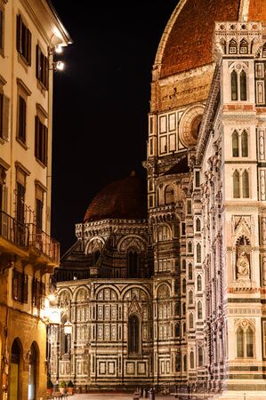Left side of Cathedral Santa Maria of the Flowers and the Baptistery, Piazza del Duomo, Florence, Tuscany, Italy, Europe. The little dome sheltered by the famous big one in the heart of the night.の写真素材