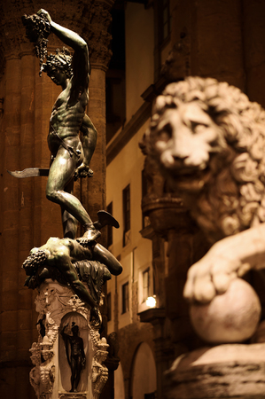 Perseus Statue and the Medici Lion - Loggia del Lanzi, Piazza de la Signora, Florence, Tuscany, Italy, Europe Protected by the Giant Lion, Perseus proudly hold the Head of Medusaの写真素材