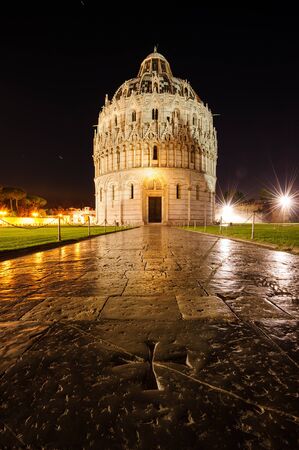 Darkness are growing around the Baptistery at The Leaning Tower, Piazza dei Miracoli, Duomo, Pisa, Tuscany, Italy, Europe.の写真素材
