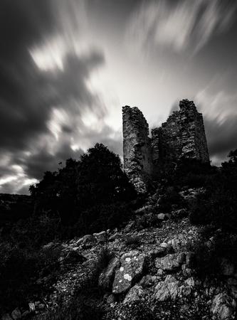 The tower near Agia Varvara under a dramatic cloudy sky, Kythira, Cyclades, Ionan and Mediterranean Sea, Greece, Europe.の写真素材
