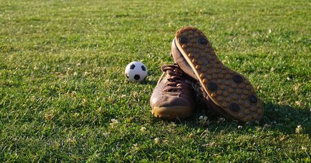 Football boots at sports fieldの写真素材