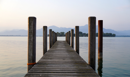 lonely landing stage with mountain at backgroundの写真素材