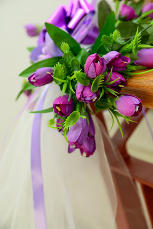 Purple artificial flowers that stand as decoration in the spaceの写真素材