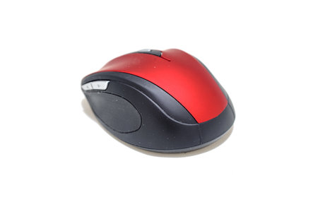 Red black computer mouse on a white background from several anglesの写真素材