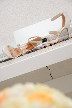 elegant open women's shoes with zircons on piano studs as a concept of music and luxuryの写真素材