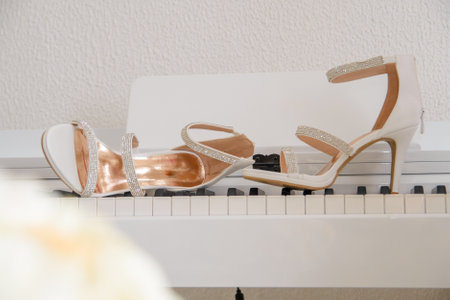 elegant open women's shoes with zircons on piano studs as a concept of music and luxuryの写真素材