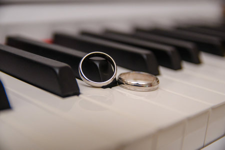 Two wedding bands set on piano keysの写真素材