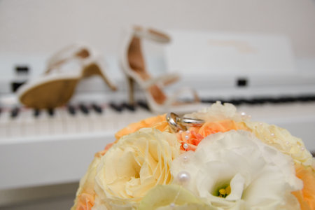 Wedding rings on a biedermeier of pastel flowersの写真素材