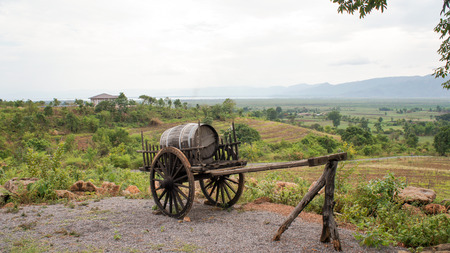 Barrel on a wagon overlooking a vineyard in burmaの写真素材