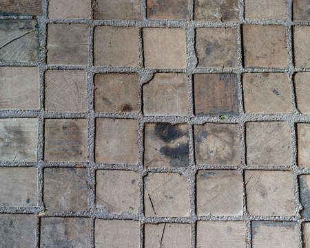 Antique small solid oak blocks end grain flooring. Courtyard wood cubes flooring. Background....