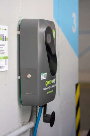 Banska Bystrica, Slovakia - June, 26, 2021 : EV charging station or electric vehicle supply equipment (EVSE) placed in the Shopping mall for public use.のeditorial素材