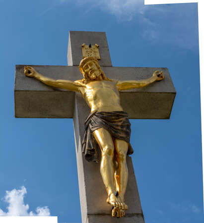 Golden crucified Jesus Christ on the cross. Close up. Detail. Nitra Calvary. Slovakia.の写真素材