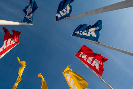 Bratislava, Slovakia - January, 2, 2022 : IKEA flags against the blue sky. IKEA has been the world's...