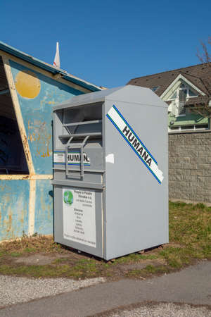 Nova Bana, Slovakia - Febuary, 27, 2022 : Humana container for used clothing, shoes, bags, belts and textile. People helping other people concept.のeditorial素材