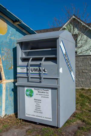 Nova Bana, Slovakia - Febuary, 27, 2022 : Humana container for used clothing, shoes, bags, belts and textile. People helping other people concept.のeditorial素材