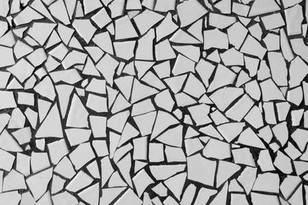 Broken white ceramic tiles mosaic. Abstract. Background. Texture.の写真素材