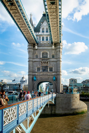 London, UK - May, 7, 2023 : People walking on Tower Bridge in London.  The Tower Bridge was built between 1886 and 1894 .のeditorial素材