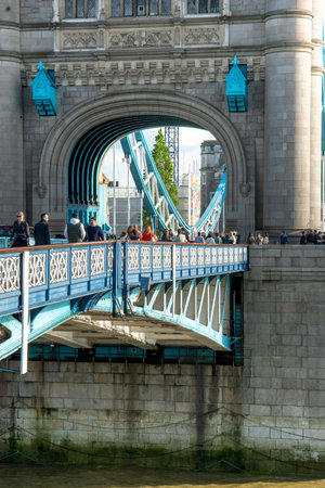 London, UK - May, 7, 2023 : People walking on Tower Bridge in London.  The Tower Bridge was built between 1886 and 1894 .のeditorial素材