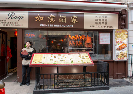 London, UK - May, 8, 2023 : The front window of a chinese restaurant in London Chinatown District. UK.のeditorial素材