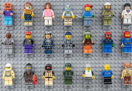 Nova Bana, Slovakia - November, 5, 2023 : Lego mini figures on the wall. LEGOÂ® Minifigures on Lego baseplates in a row.のeditorial素材
