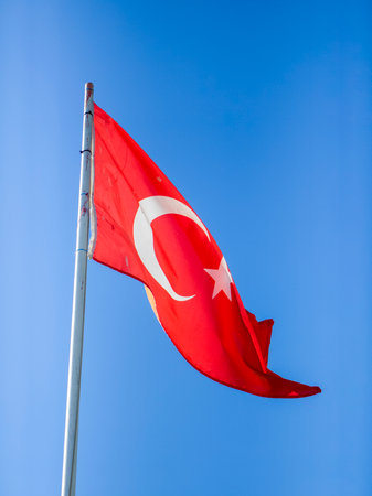 Turkish flag against the blue sky. The flag of Turkey, Alsancak  or Ay YÄ±ldÄ±z.