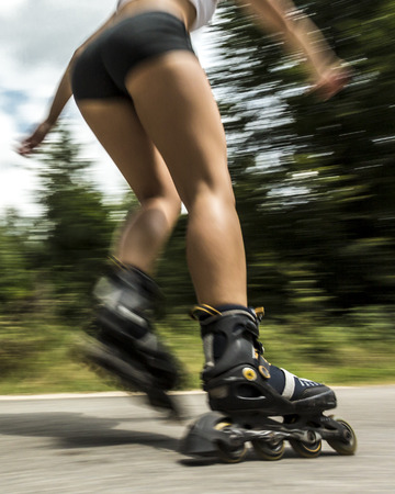 young woman inline skatingの写真素材