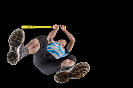 Man, 48 years, playing baseball, studio shot, bottom view through glassの写真素材